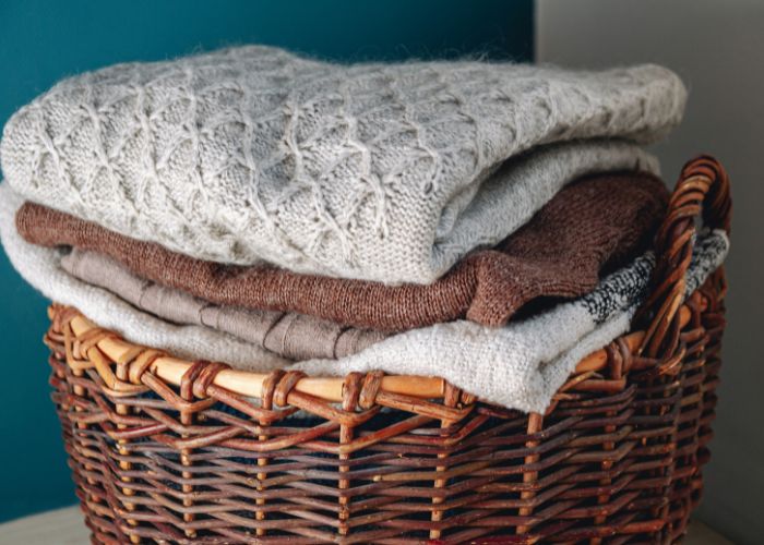 knitted mending: Basket with knitwear