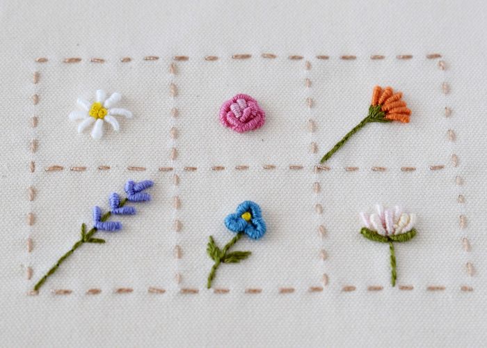 how to embroider bullion stitch flower: A finished sampler with six Bullion stitch flowers