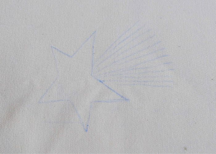 Pattern transfer marks with blue transfer paper on white fabric
