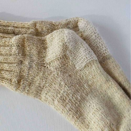 Woolen socks mended with Scotch darning stitch